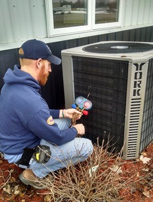 Jeremy Salzbrun testing an air conditioner.