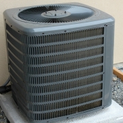 Outdoor air conditioner unit with air filter needing replacement.