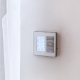 Programmable thermostat on home wall