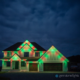 A home decorated for Christmas with red and green Gemstone Lights.