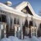 pile of snow, with icicles hanging from the roof and windows
